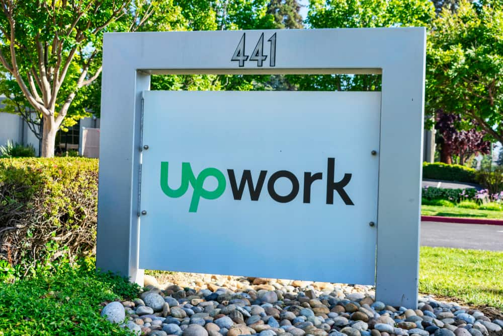 UpWork sign and logo near global freelancing platform company