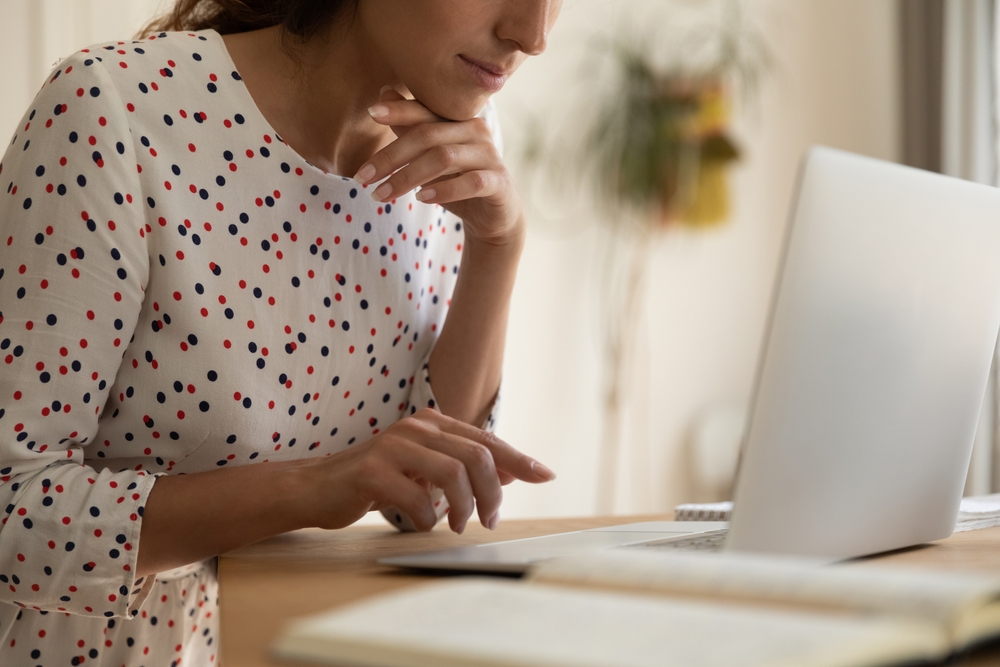 Young-woman-working-on-a-laptop-in-home-office