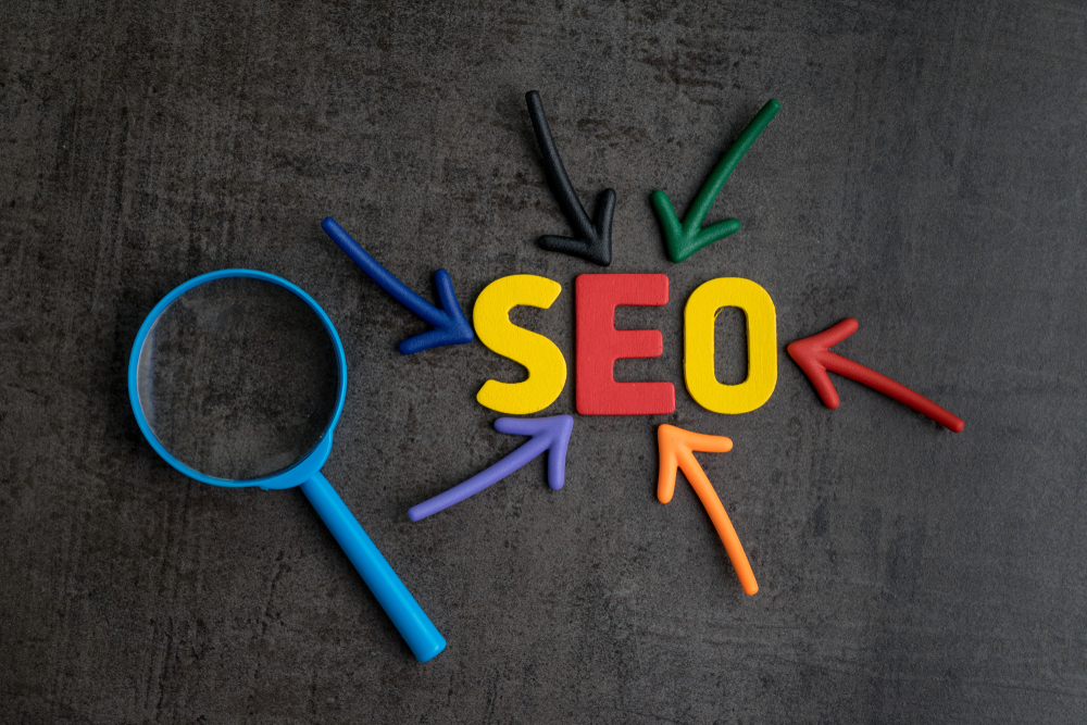 SEO-written-out-in-colorful-letters-with-arrows-pointing-to-it