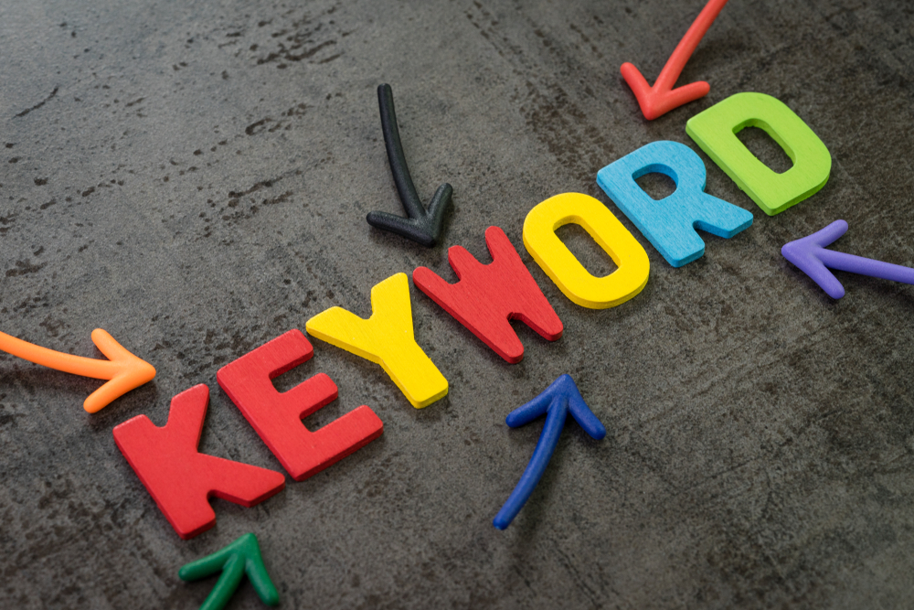 Keyword-spelled-out-in-colorful-letters-with-arrows-pointing-to-it.