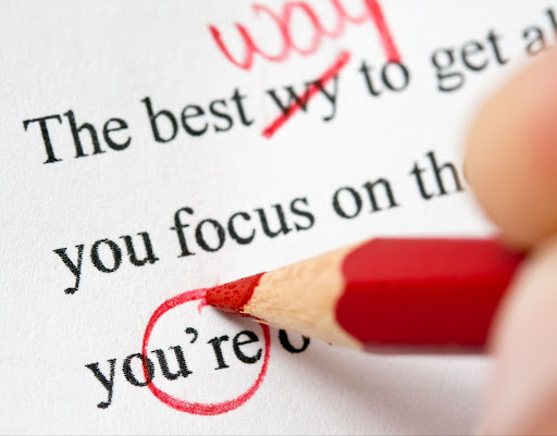 Correcting-grammar-and-spelling-errors-on-a-term-paper-with-a-red-pencil